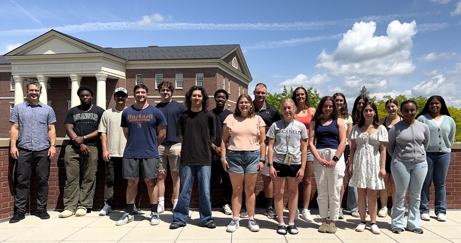The MMOT Lab group standing outside the Breakiron Engineering Building